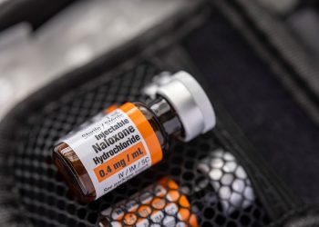 Implantable device responds to opioid overdose