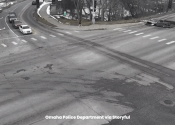 WATCH: Two cars fall into sinkhole at traffic light in Nebraska