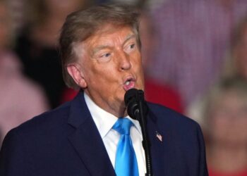 Trump brushes question off about handing out cash before election