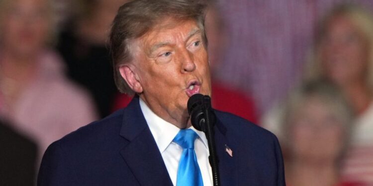 Trump brushes question off about handing out cash before election